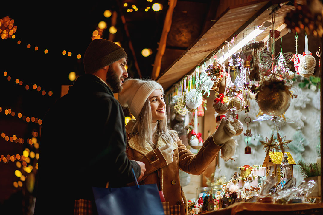 Couple in Pickering enjoying a fun activity at a Christmas Holiday Market